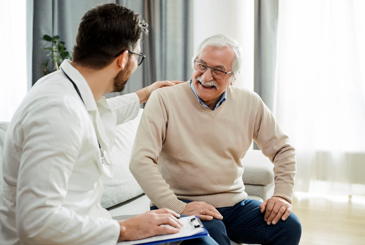 Doctor speaking with an older patient 