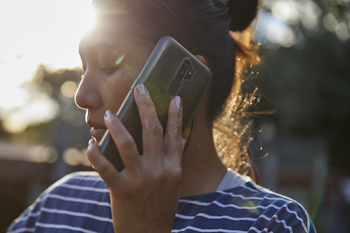 Woman talking on phone.