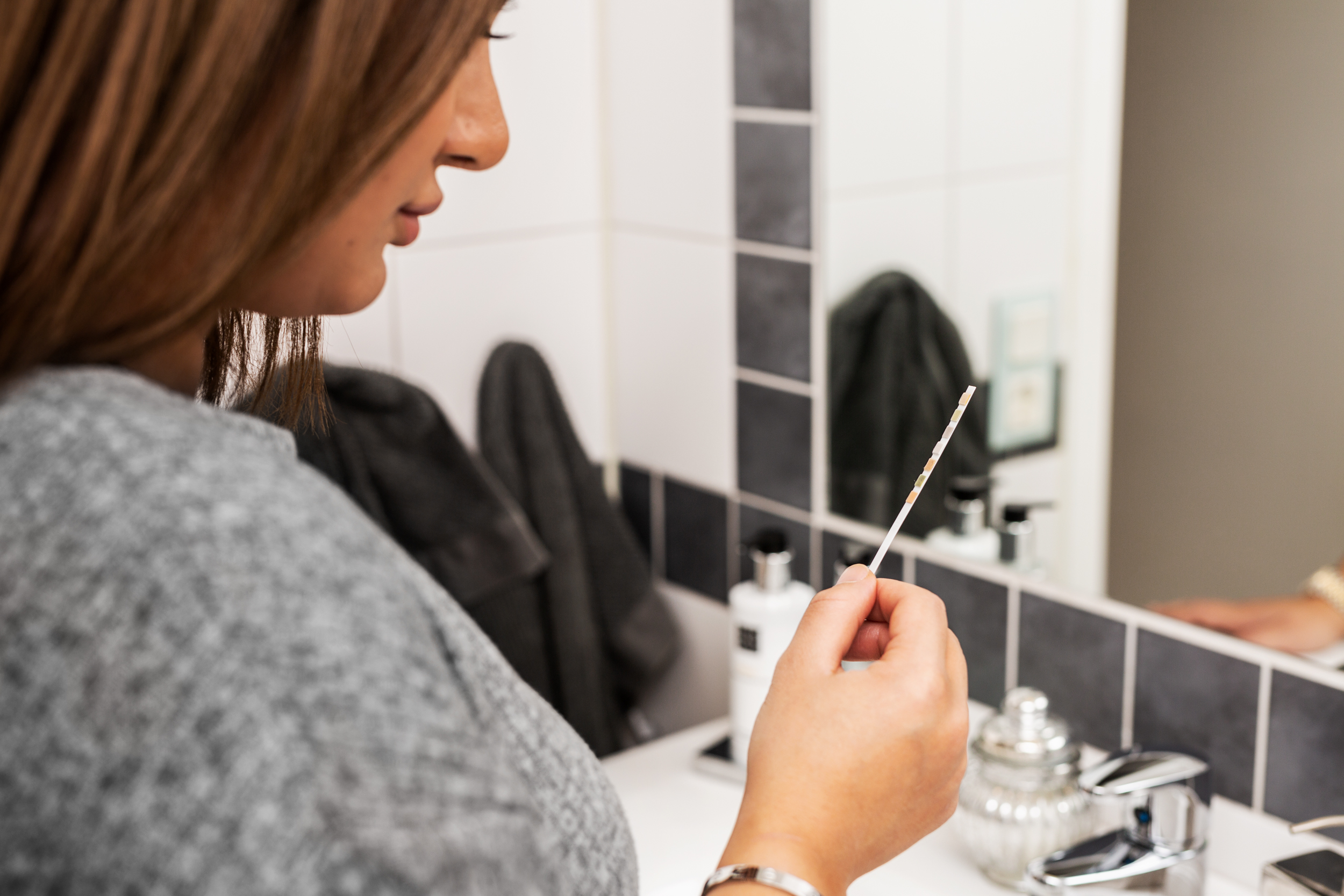 Woman Looking At Pregnancy Test