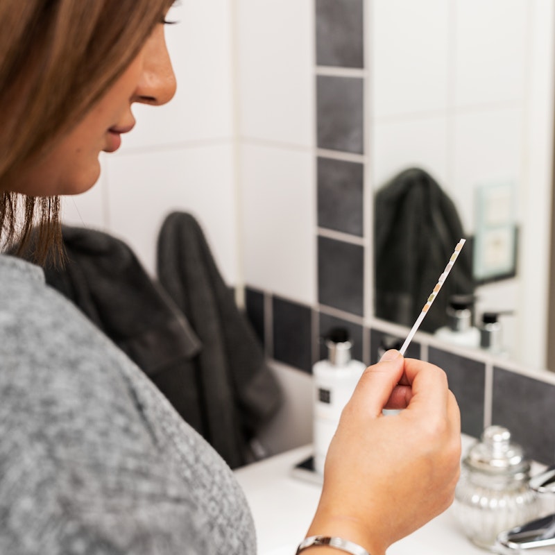 Woman Looking At Pregnancy Test