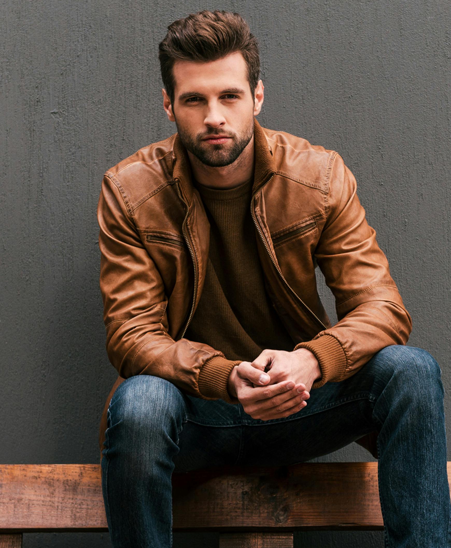 Man sitting with leather jacket and no wrinkles