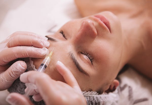Woman receiving BOTOX injections