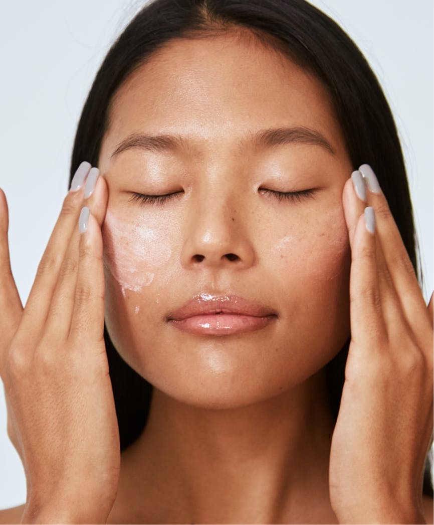 woman washing her face
