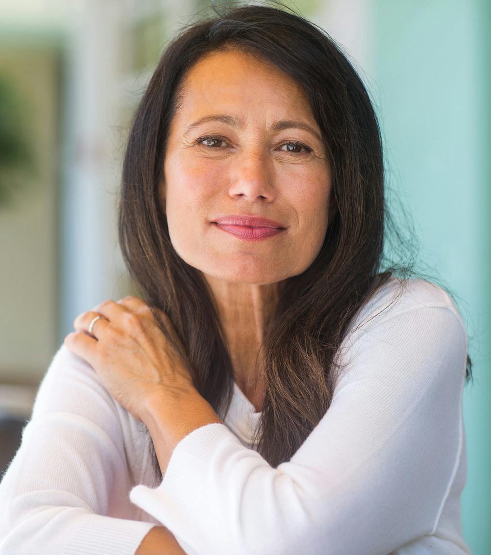 Woman in a white shirt posing