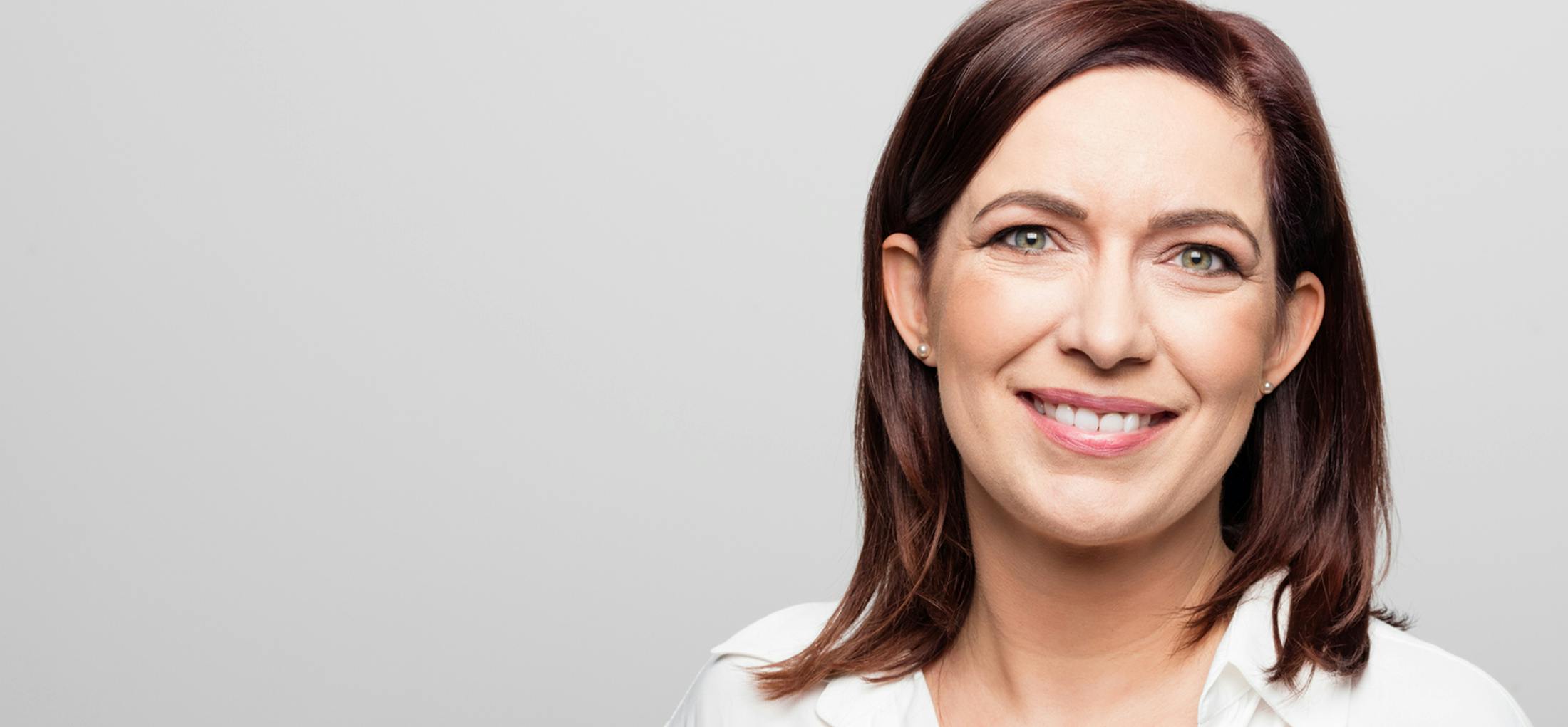 Woman with brown hair smiling