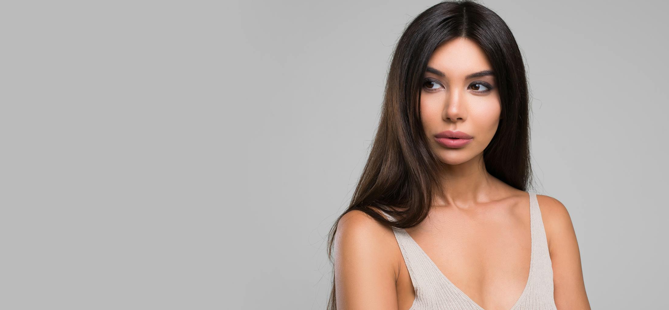 Woman with black hair posing