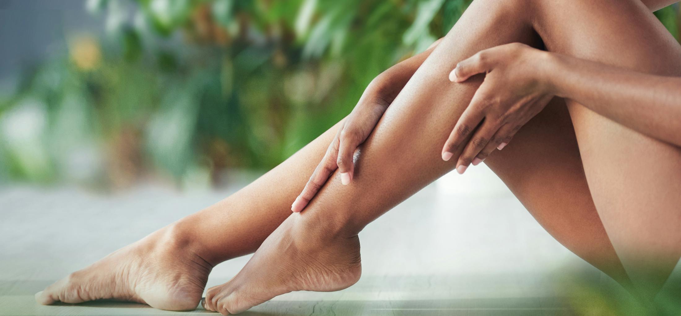Woman rubbing her legs