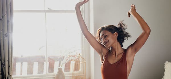 Woman with her hands up in the air