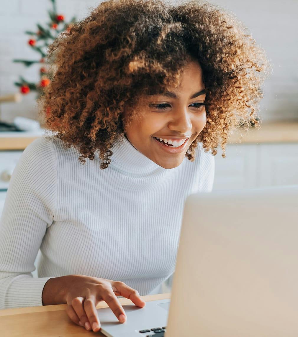 Woman sitting in front of a laptop
