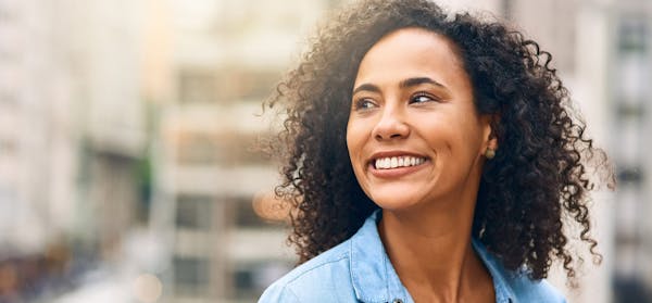 Woman with curly hair smiling