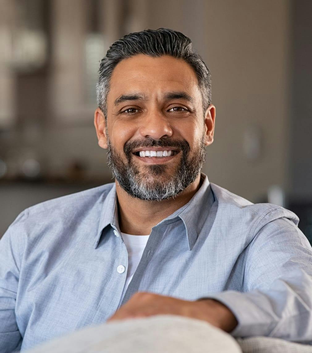 Man sitting down and smiling