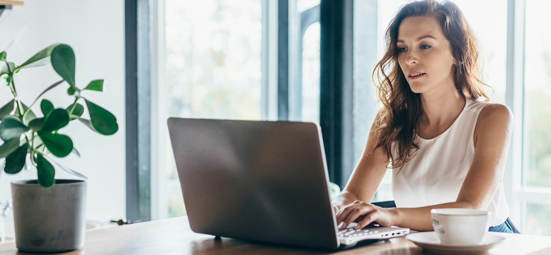 Woman sitting in front of her laptop