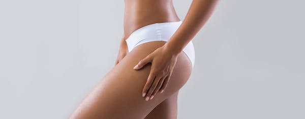 Close-up of a woman's waist and buttocks
