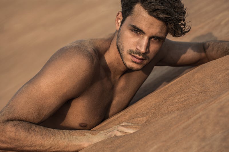 Man posing on sand