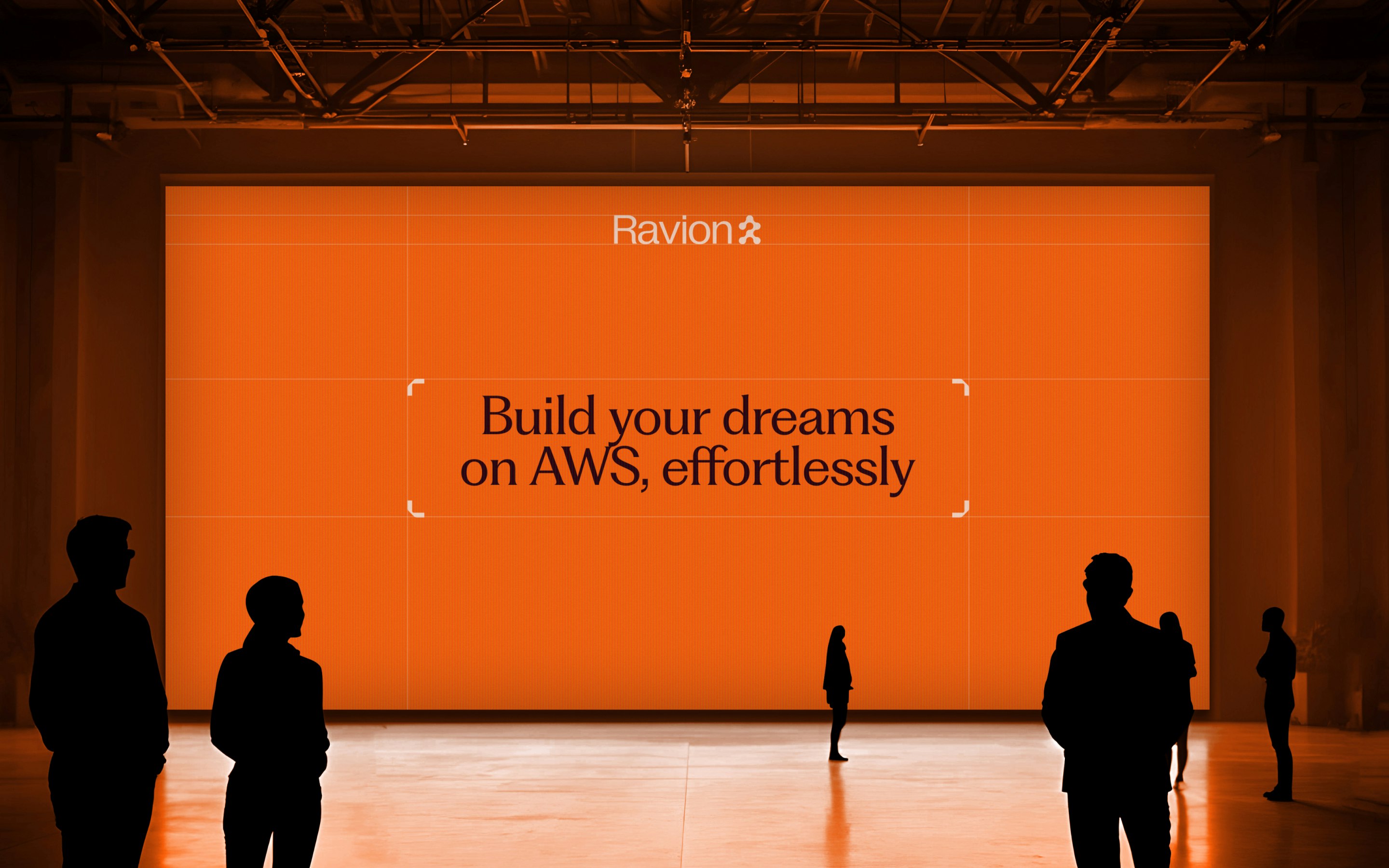 Ravion trade-show billboard with the tagline "Build your dreams on AWS, effortlessly"