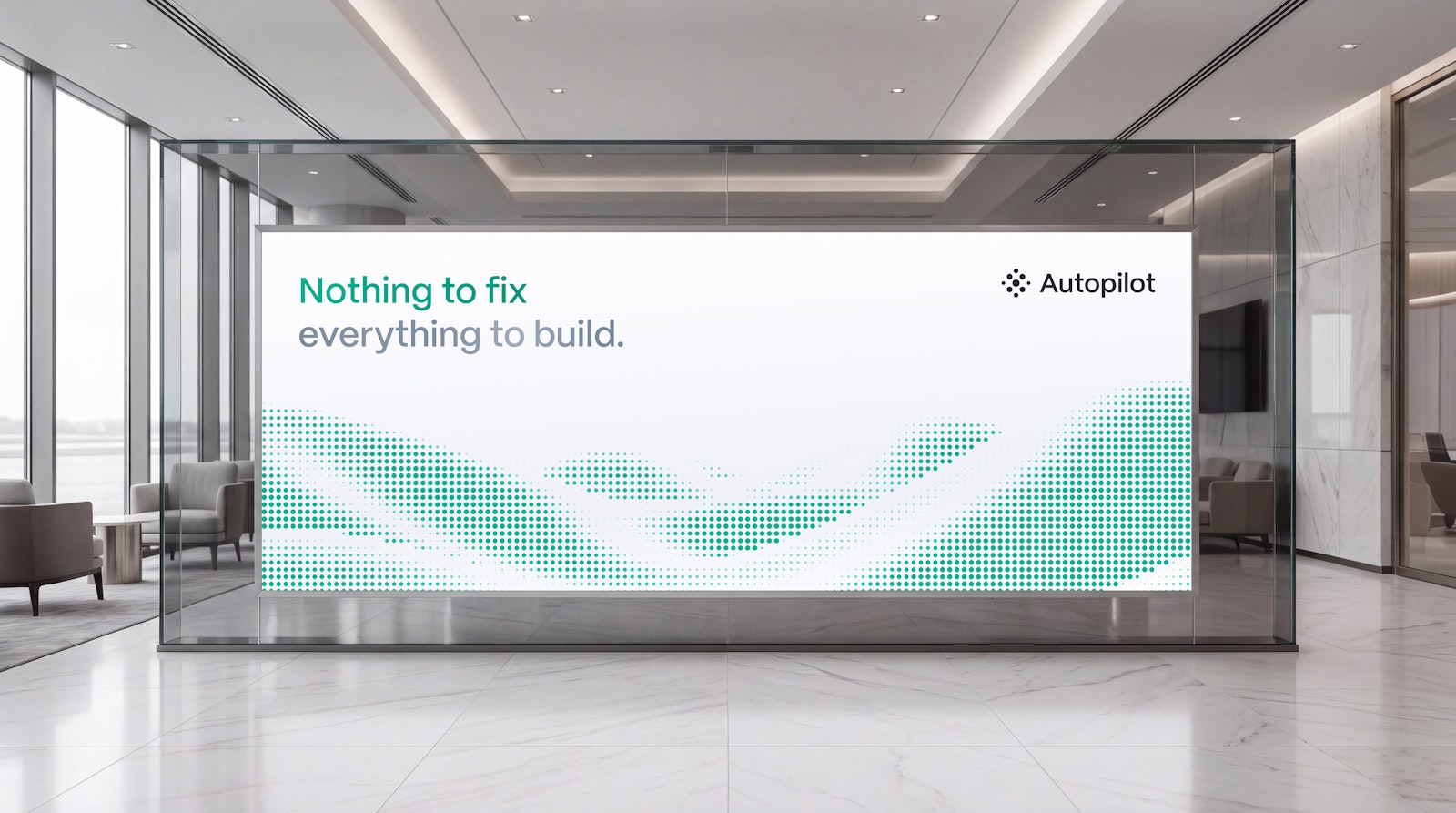 Indoor lobby glass-wall signage reading Nothing to fix, everything to build, with the Autopilot logo and a green dot-wave graphic