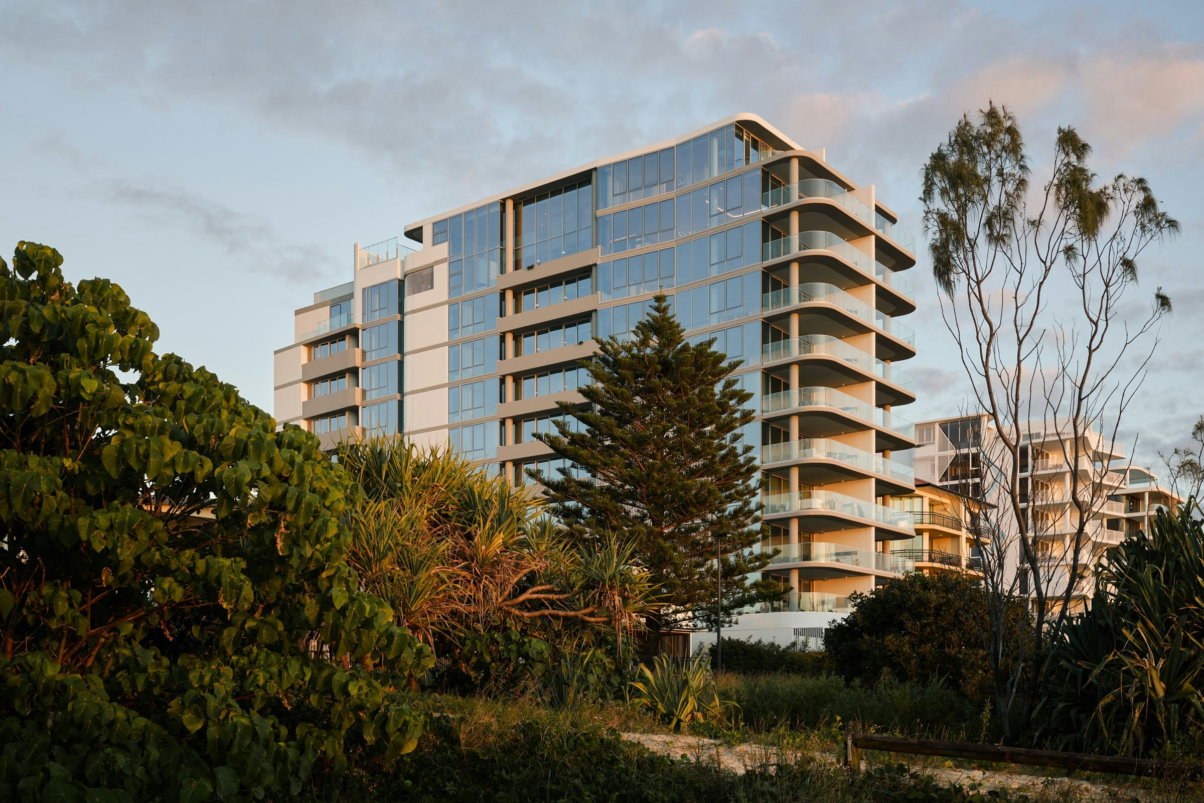 SIERA's PIPIS residences at dusk behind the dunes at Bilinga