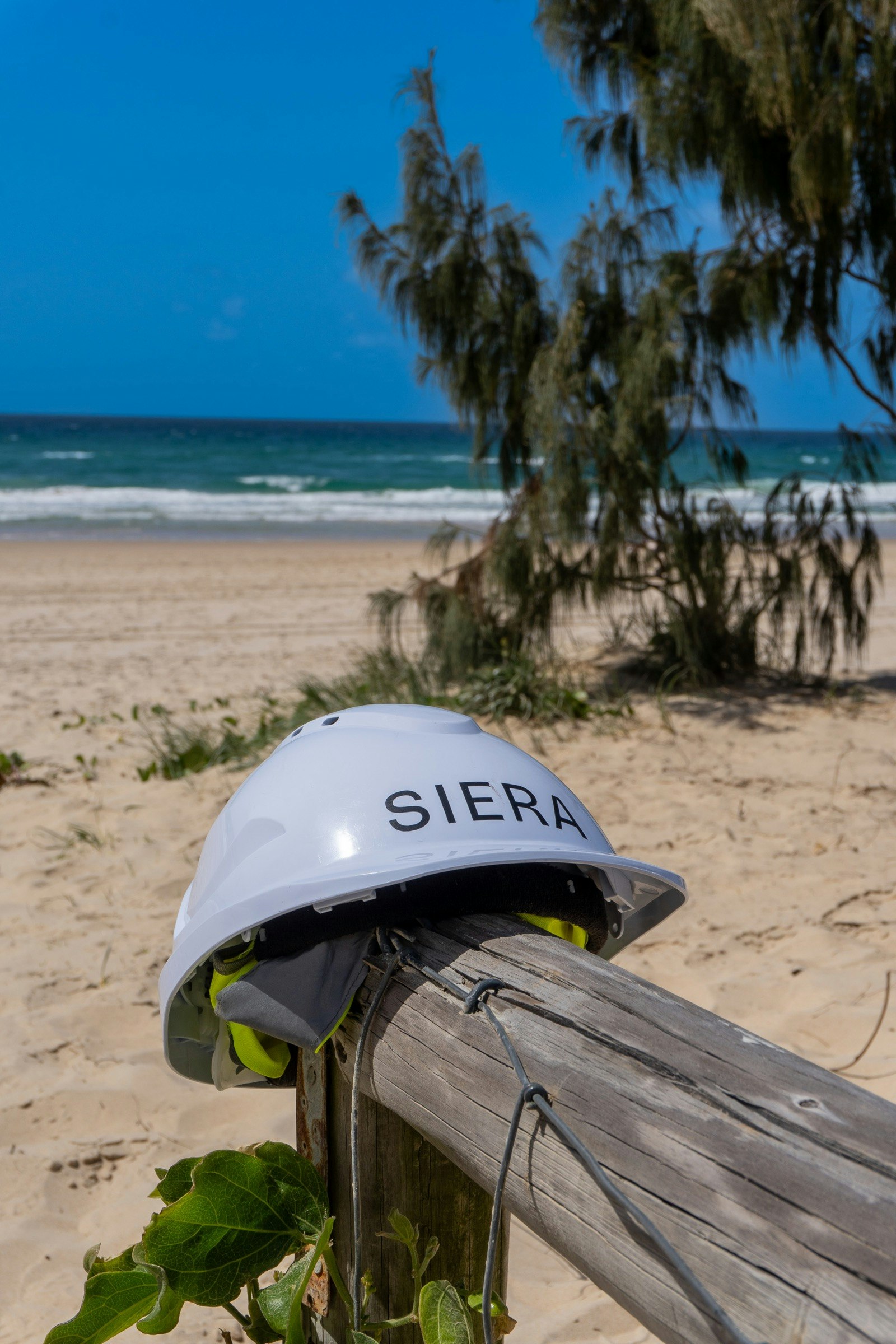 A SIERA hard hat on the beach fence at Exhale in Northcliffe, Surfers Paradise, 60 metres to the sand