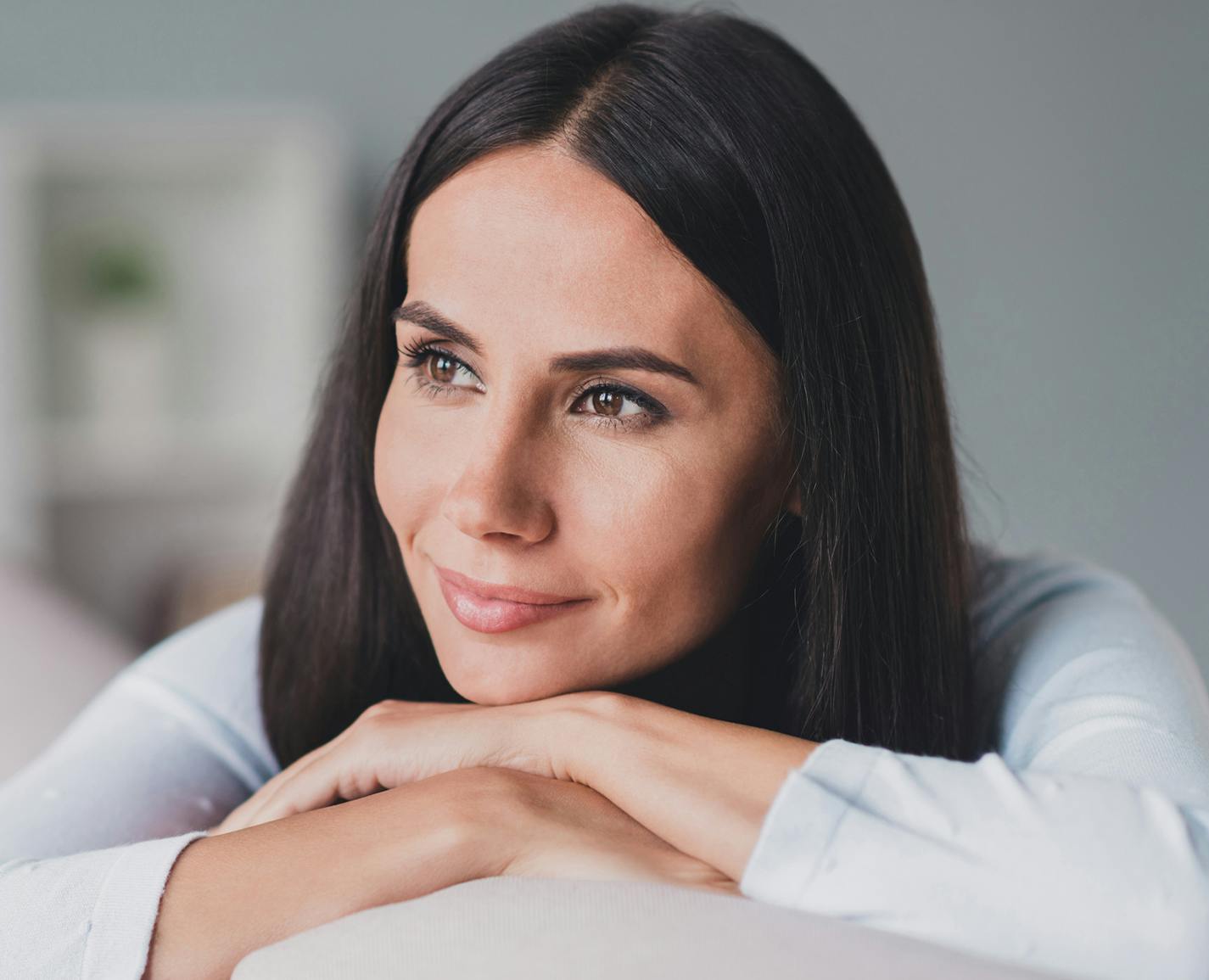 woman with her head on her hands