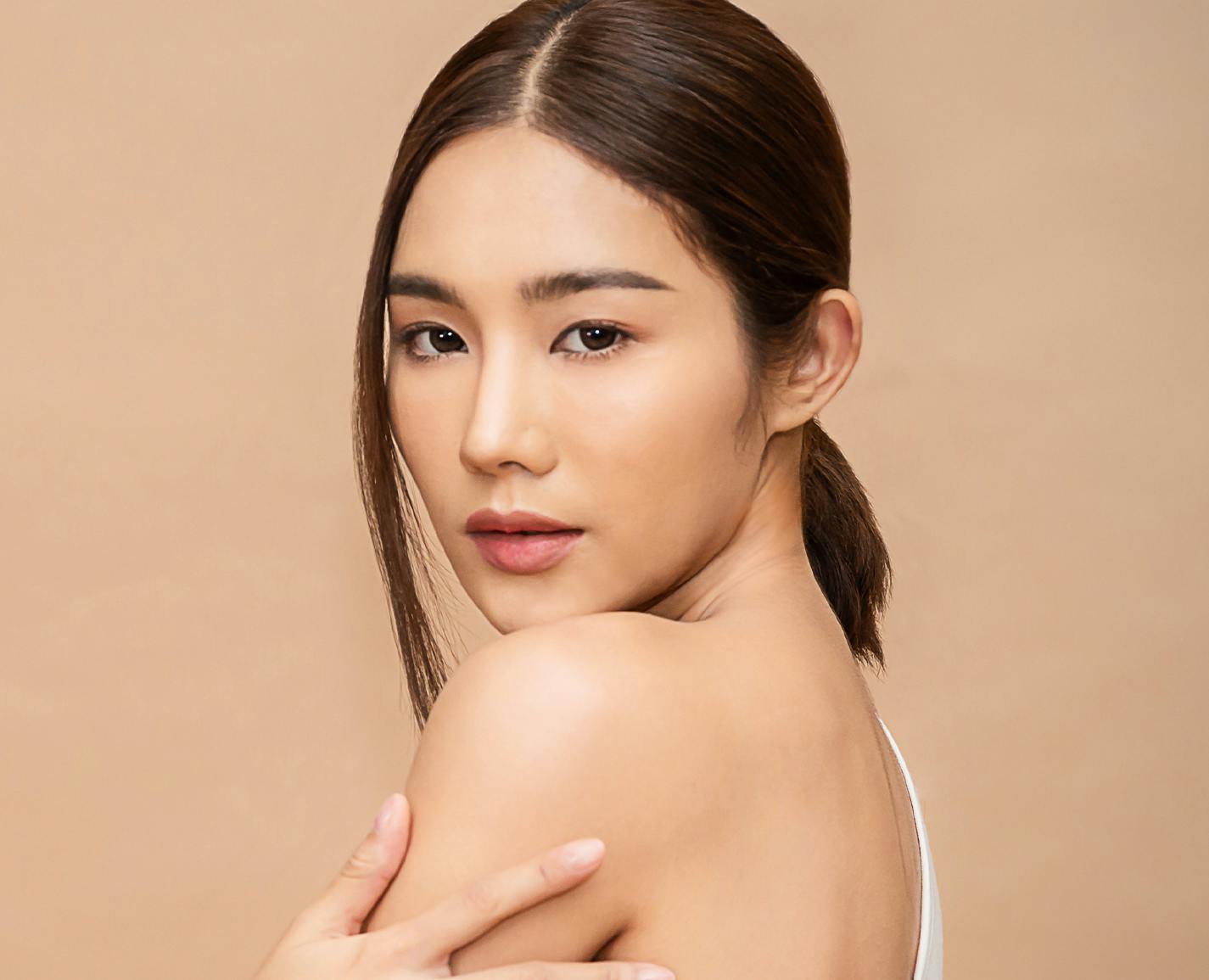 woman looking over her shoulder