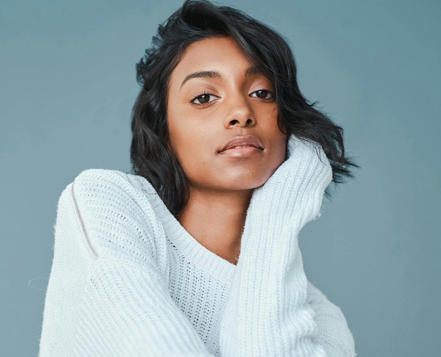 woman in a white sweater