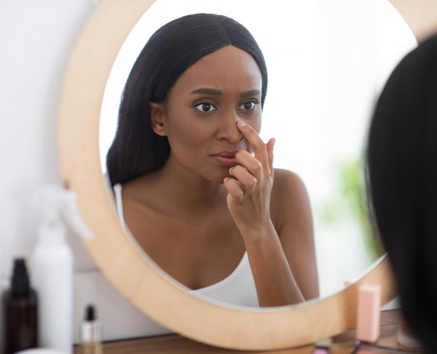 woman looking in the mirror