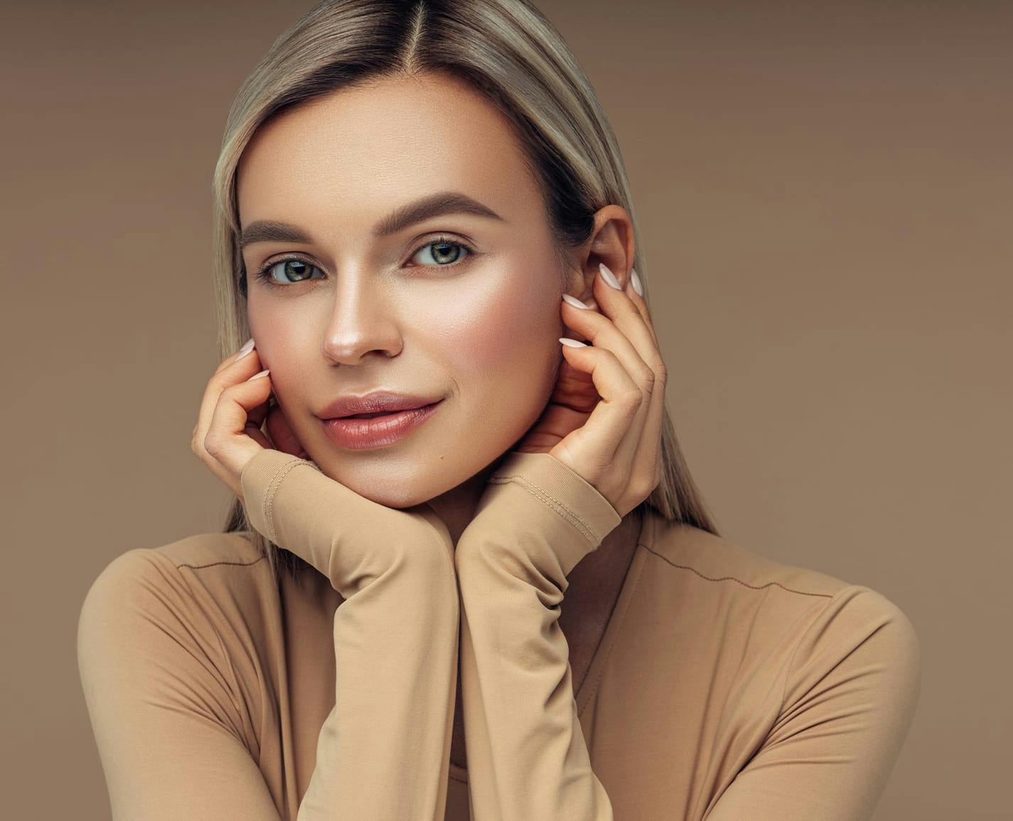 woman touching her face