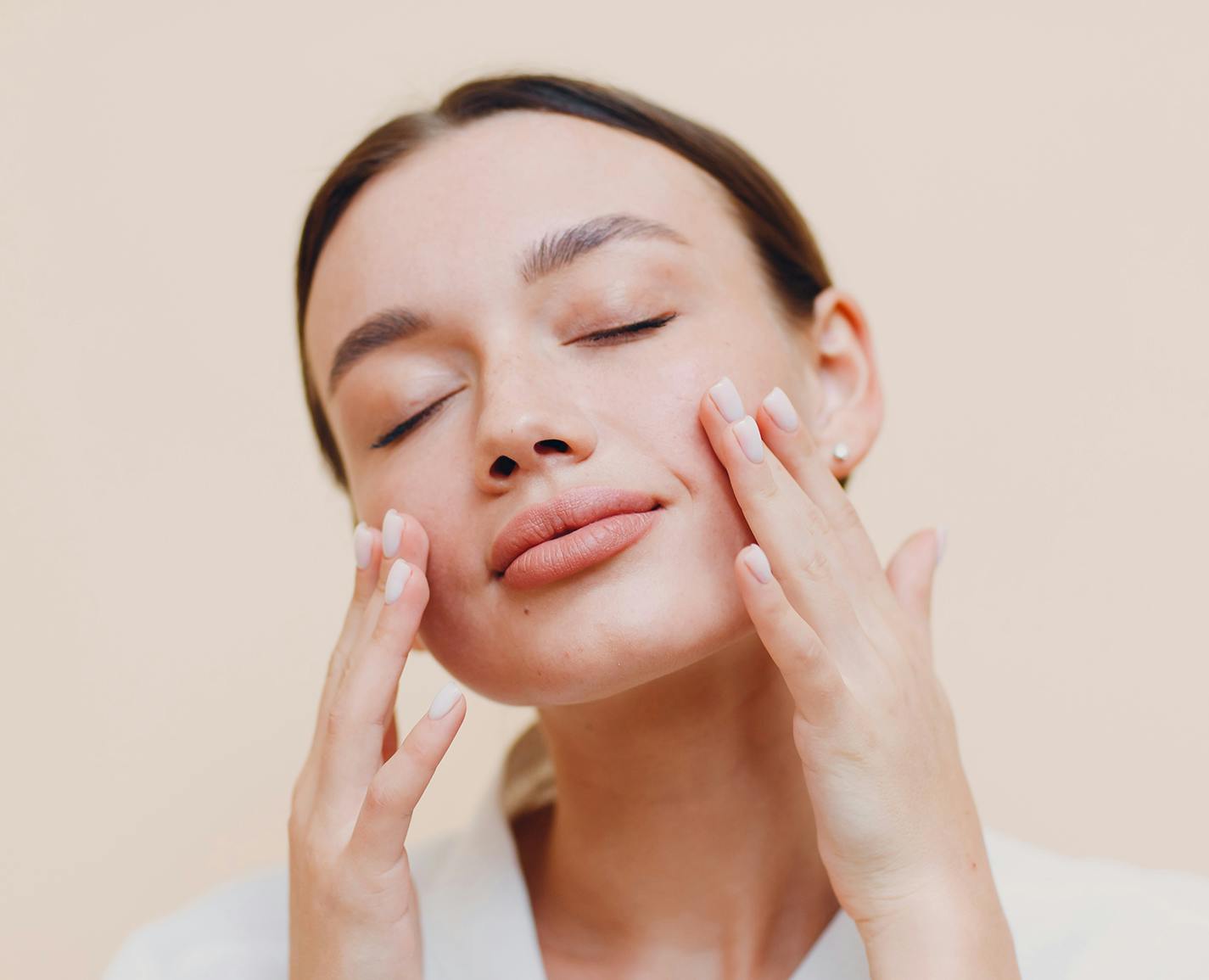 woman touching her face