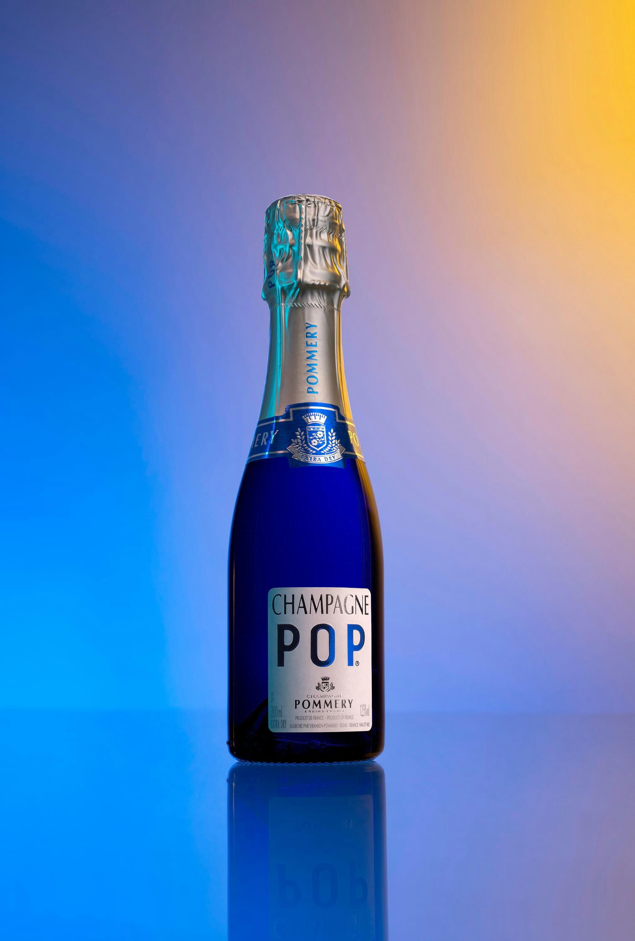 Bottle of Pommery Pop on a color blue ans yellow font