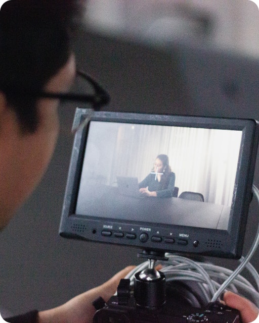 Recording Factorial An employee films a video of his colleague working