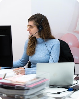 A consultant works with a client over the phone