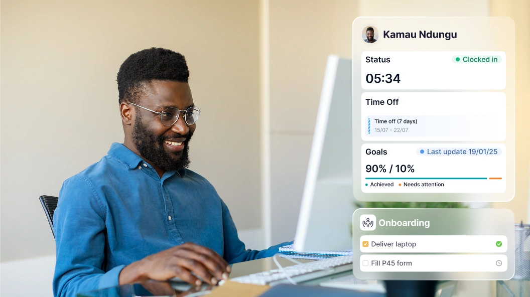 Employee portal KE A man smiling while working at a computer, with Factorial's employee portal laid over