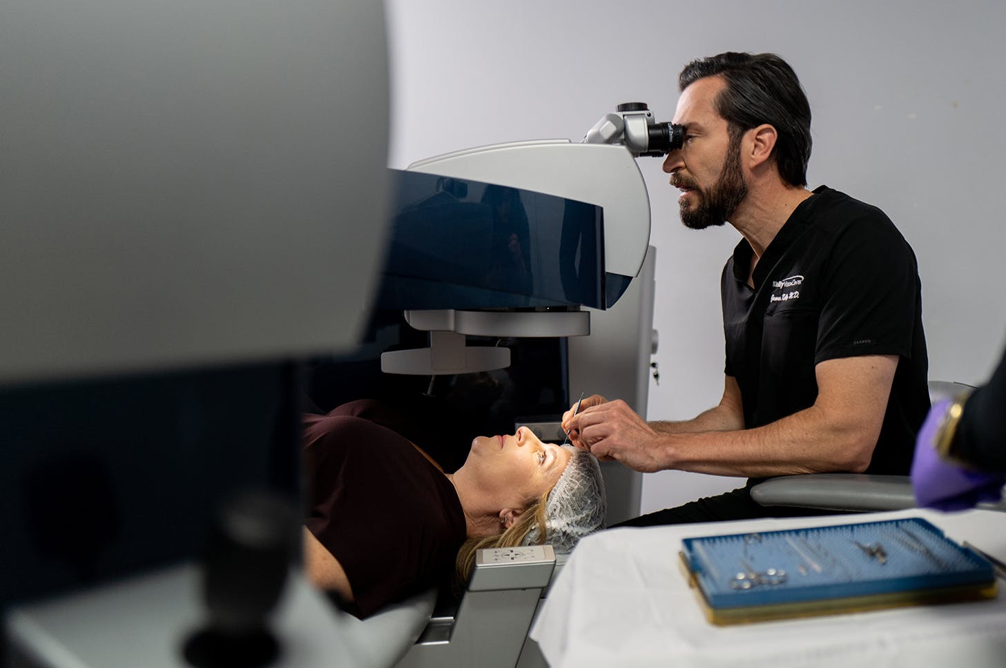 Dr. James Kelly with Kelly Vision performing eye procedure on client