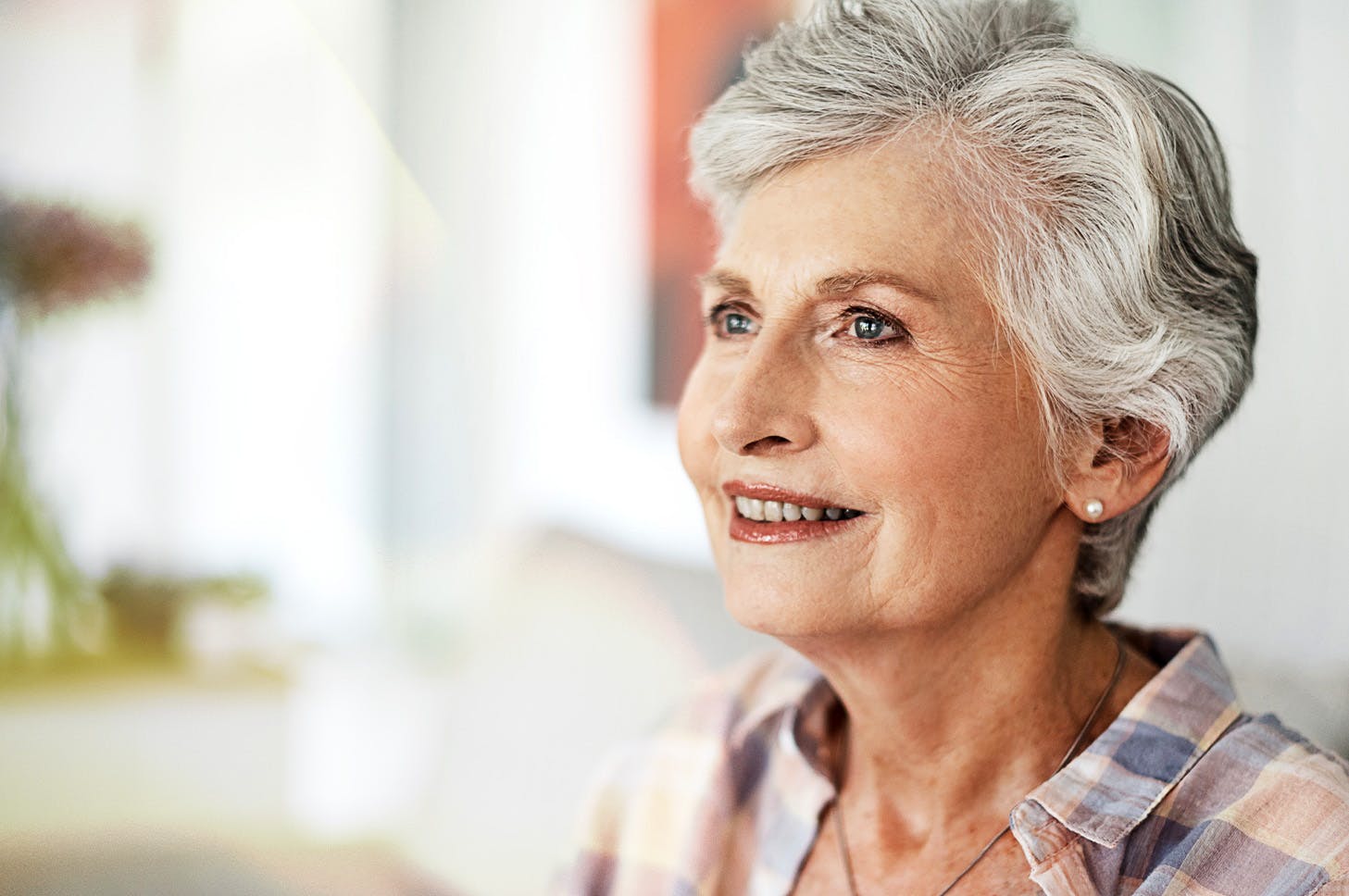 older lady looking out and smiling