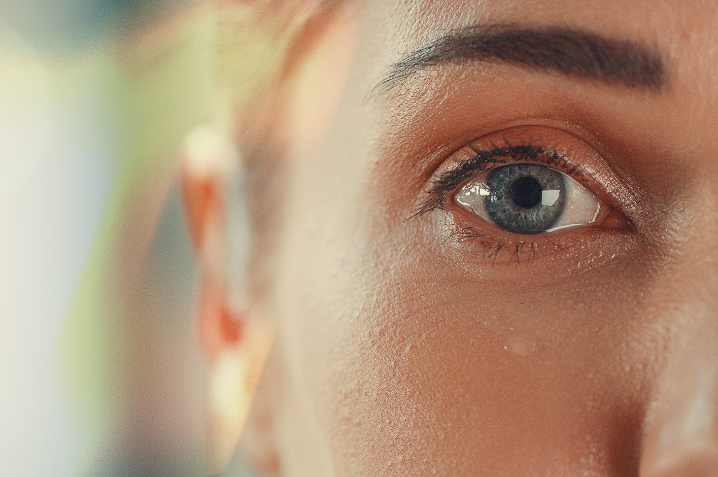 close up of a ladies blue right eye