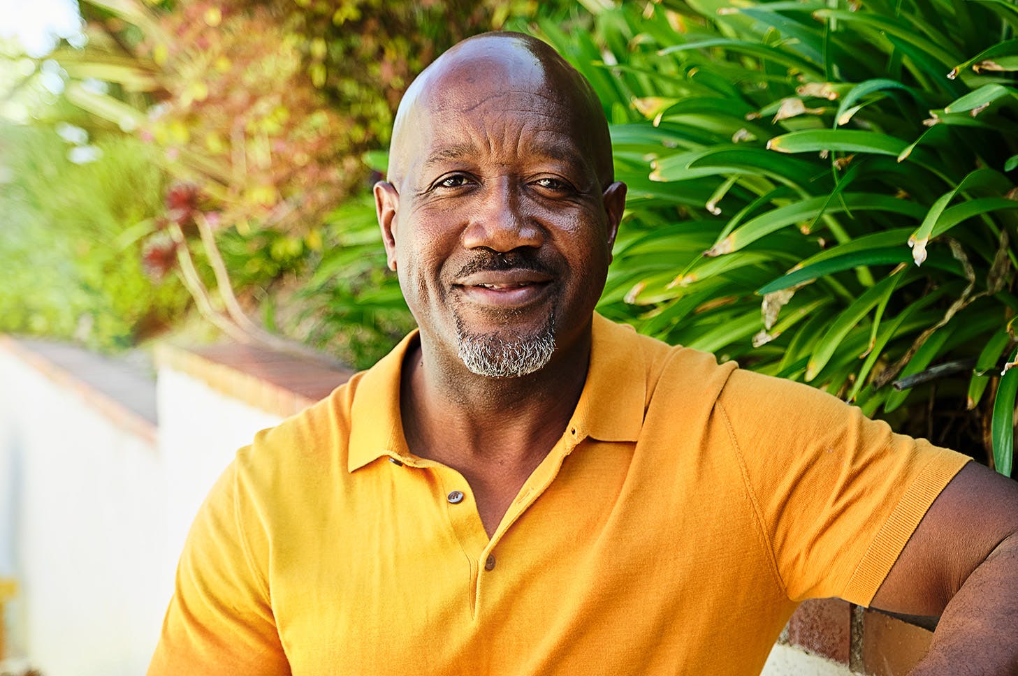 man looking straight and smiling