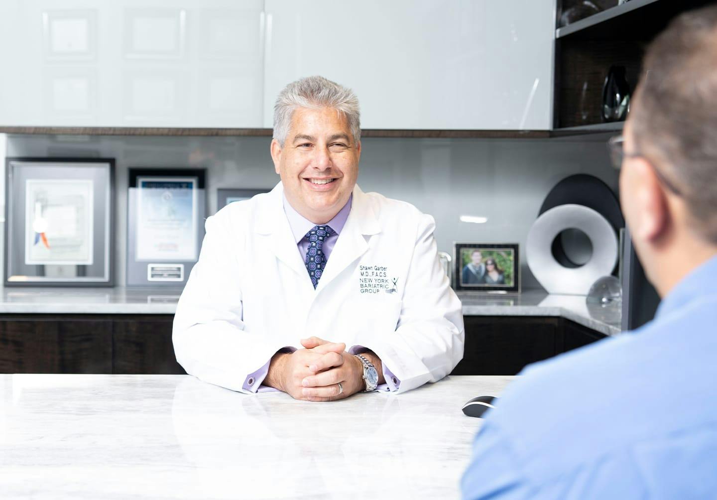 Doctor with his hands together