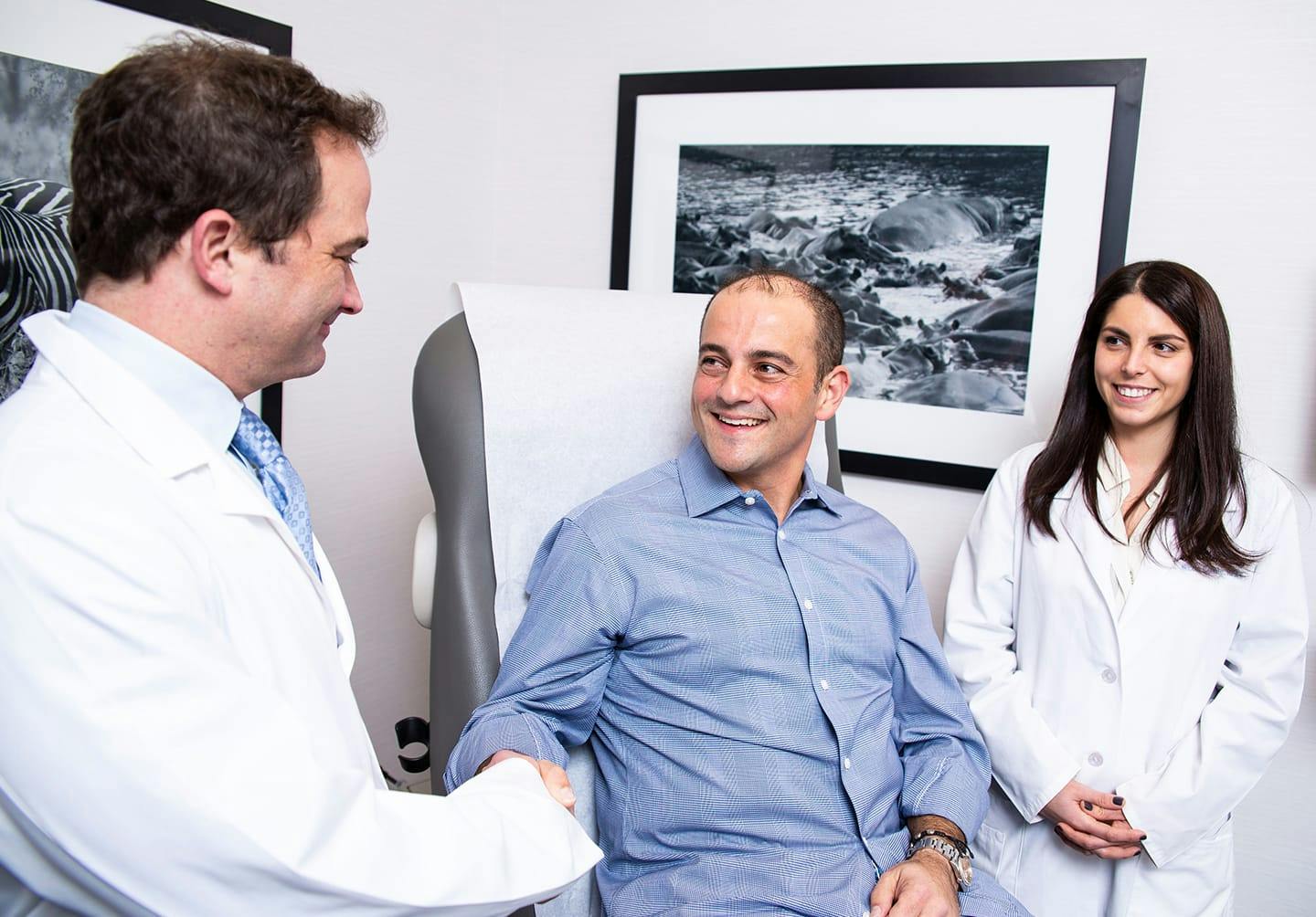 Man shaking doctor's hand