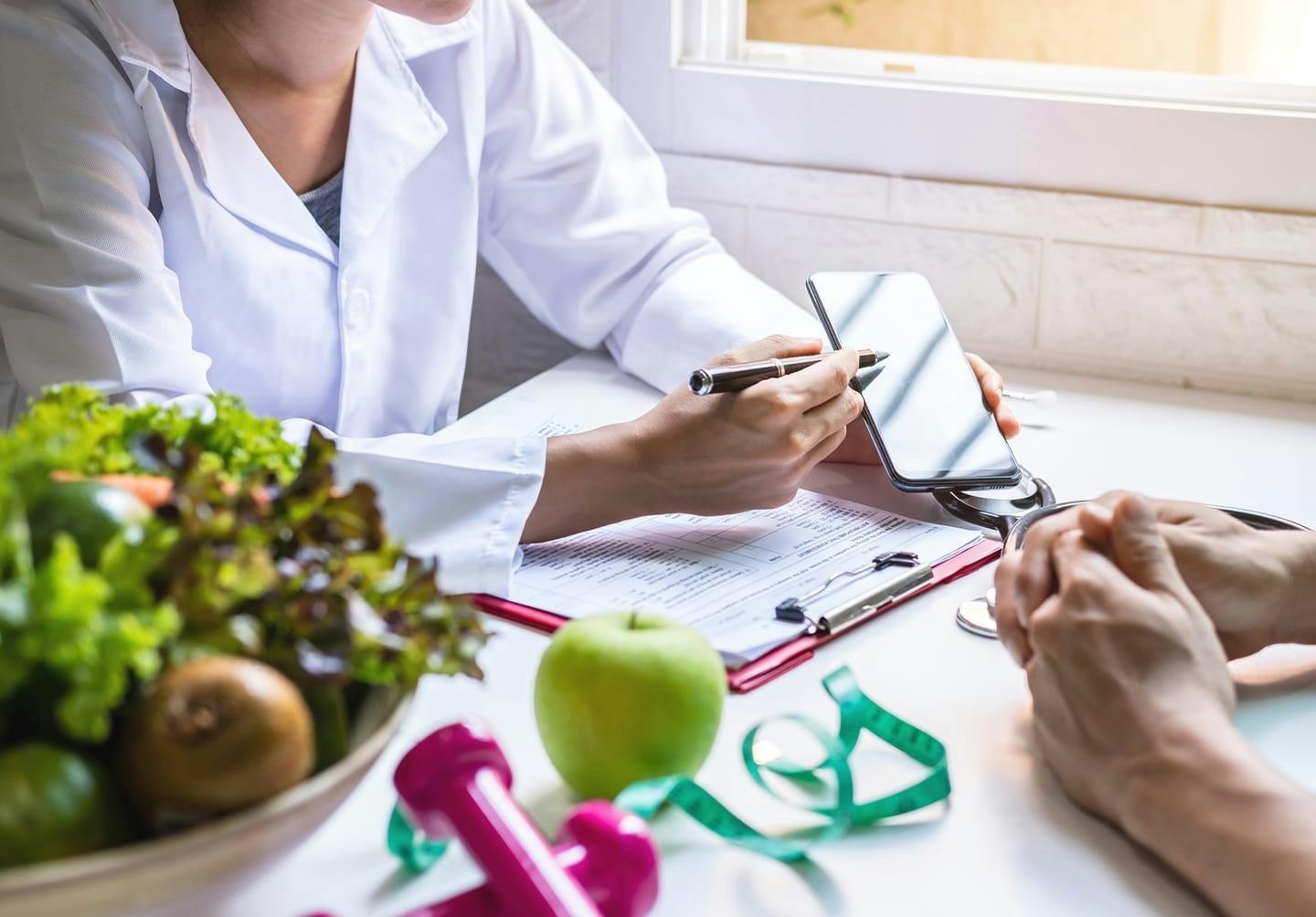 Doctor showing person something on a phone