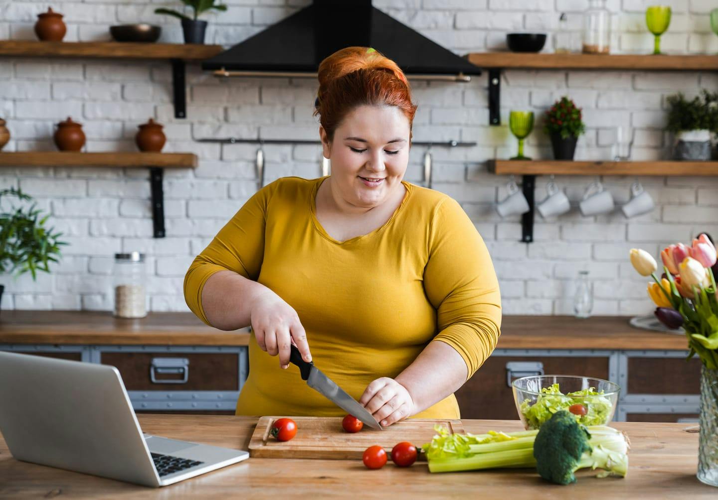 Woman cutting tomatos