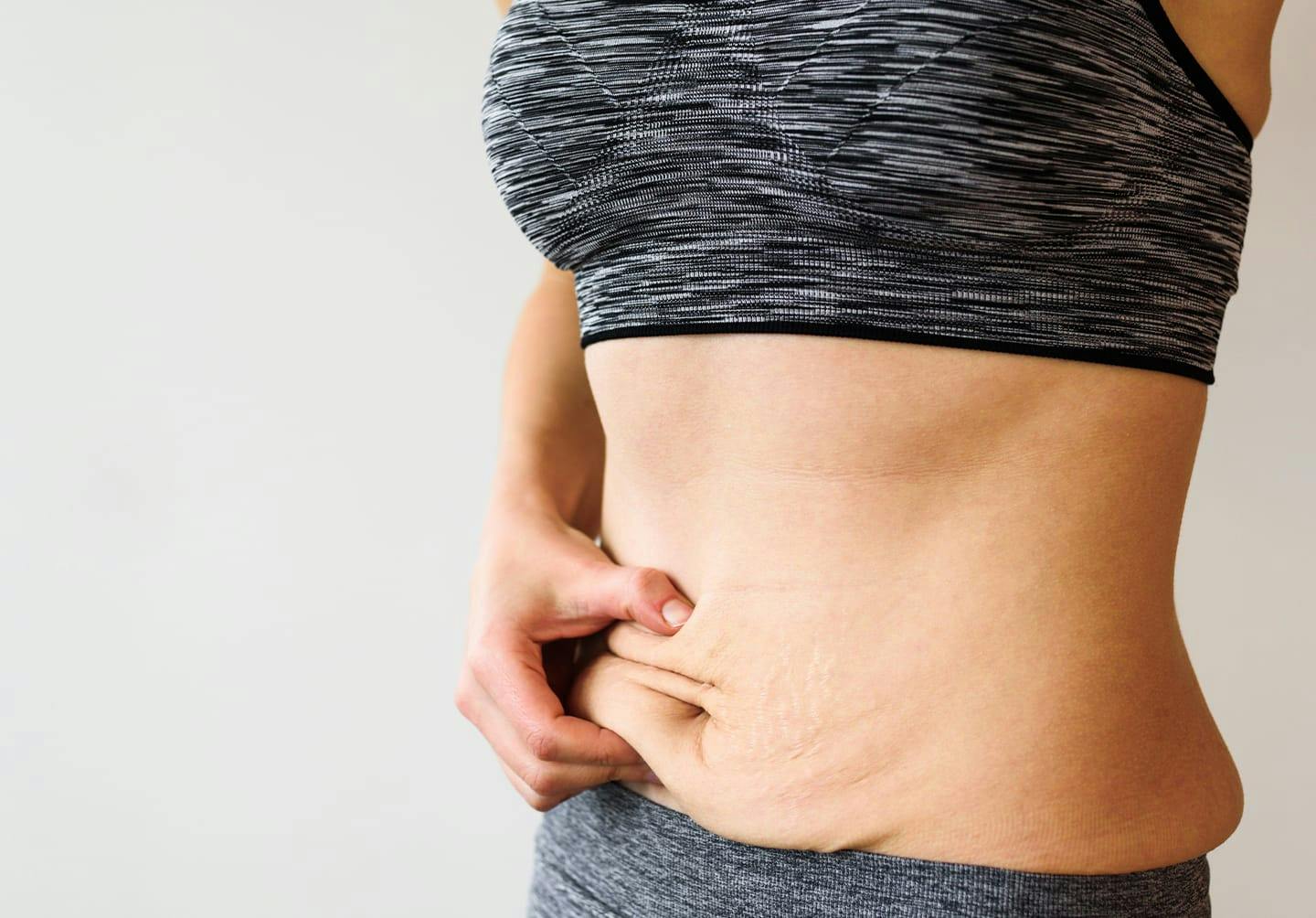 Woman touching her stomach