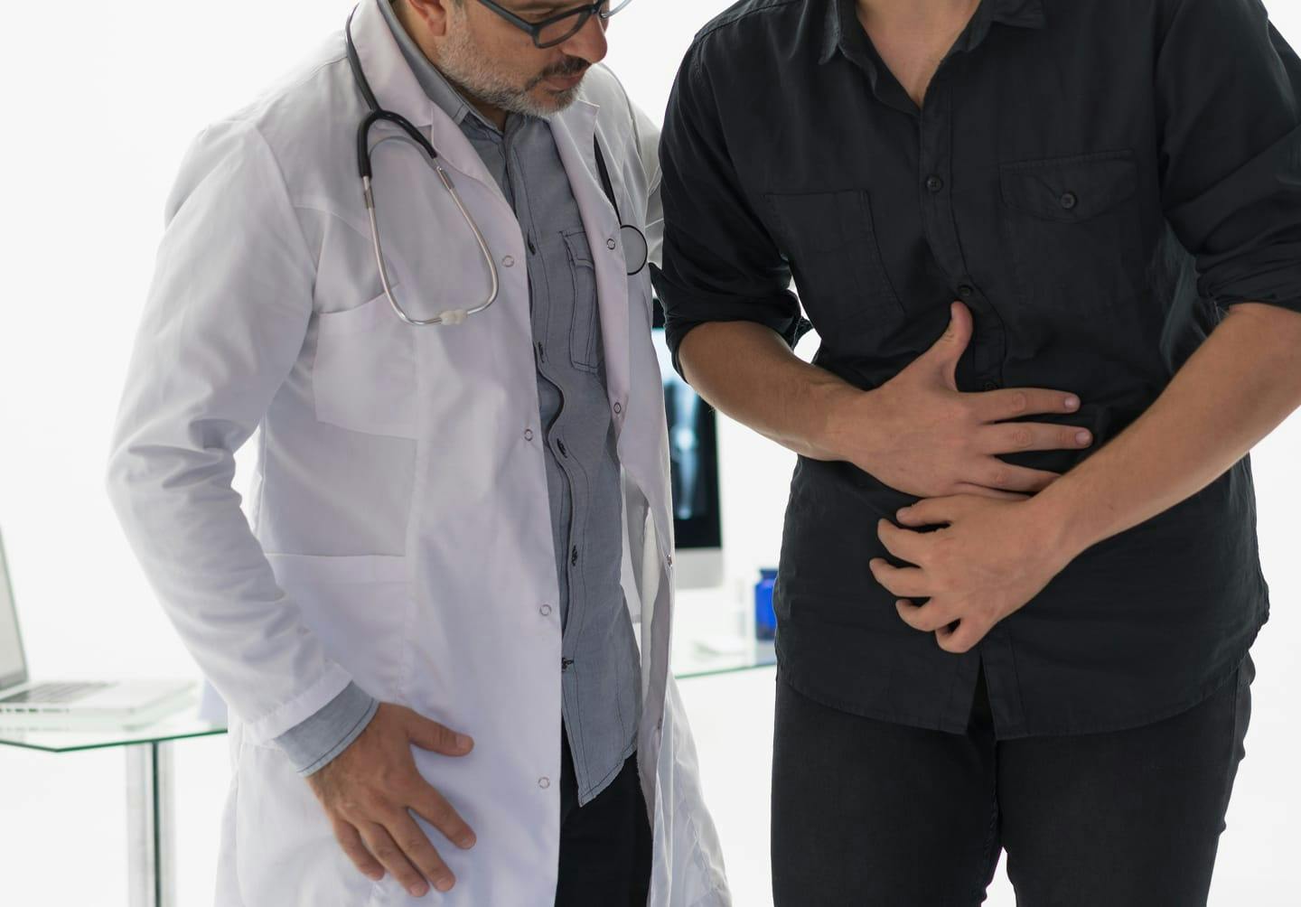 Man holding his stomach in pain