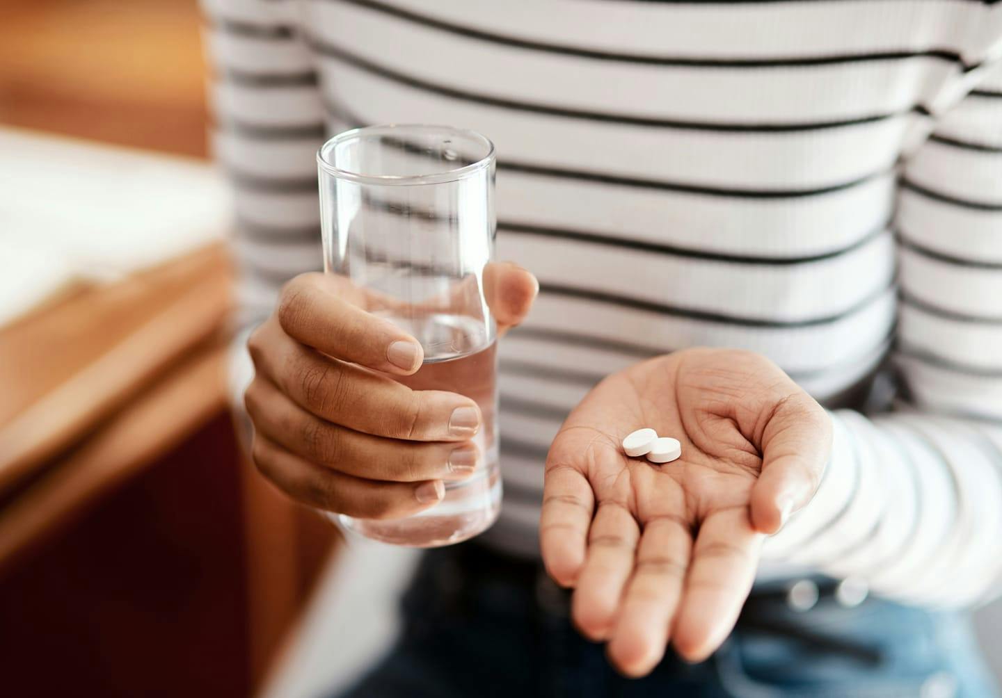 Woman taking medicine