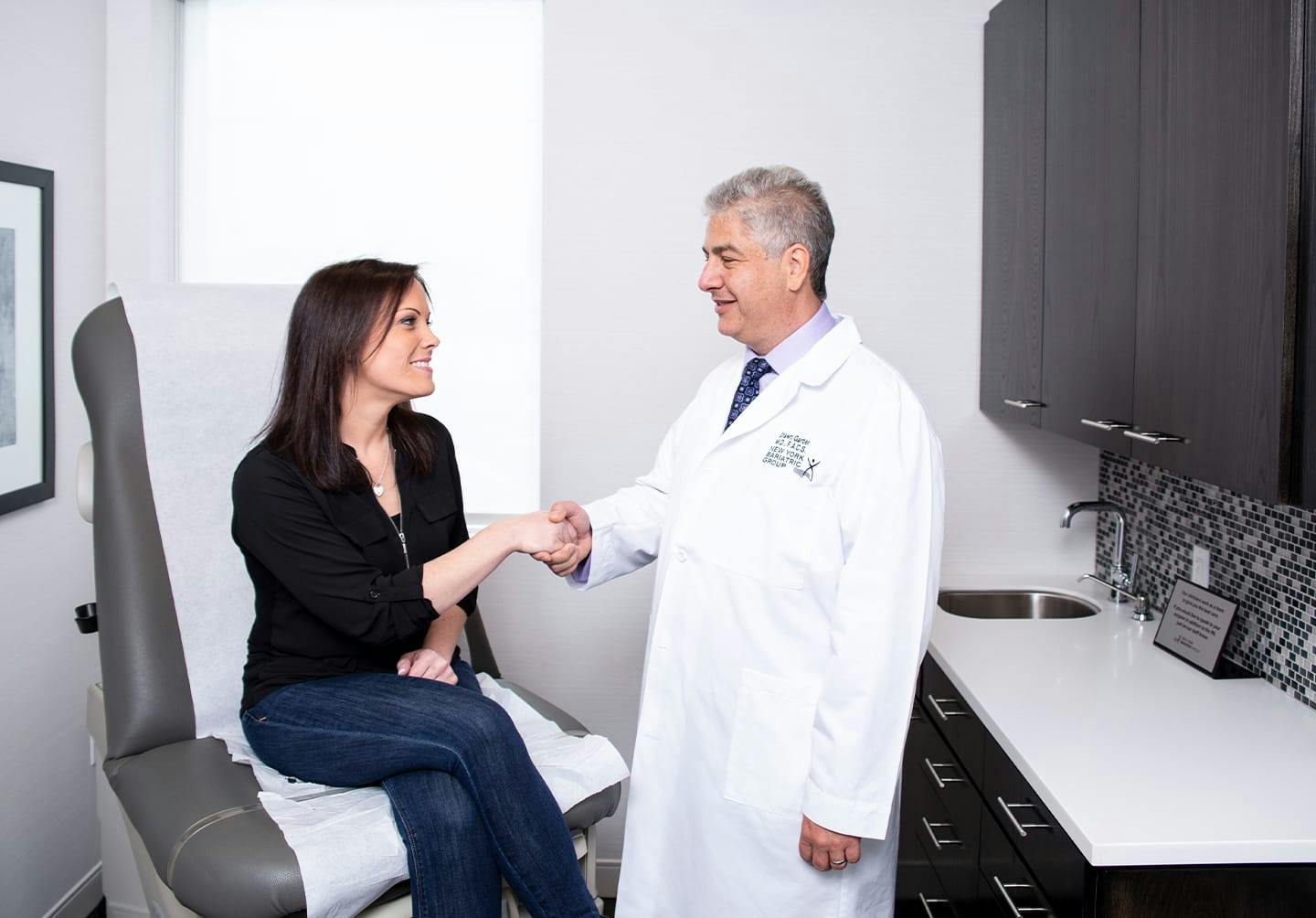 Woman shaking doctor's hand