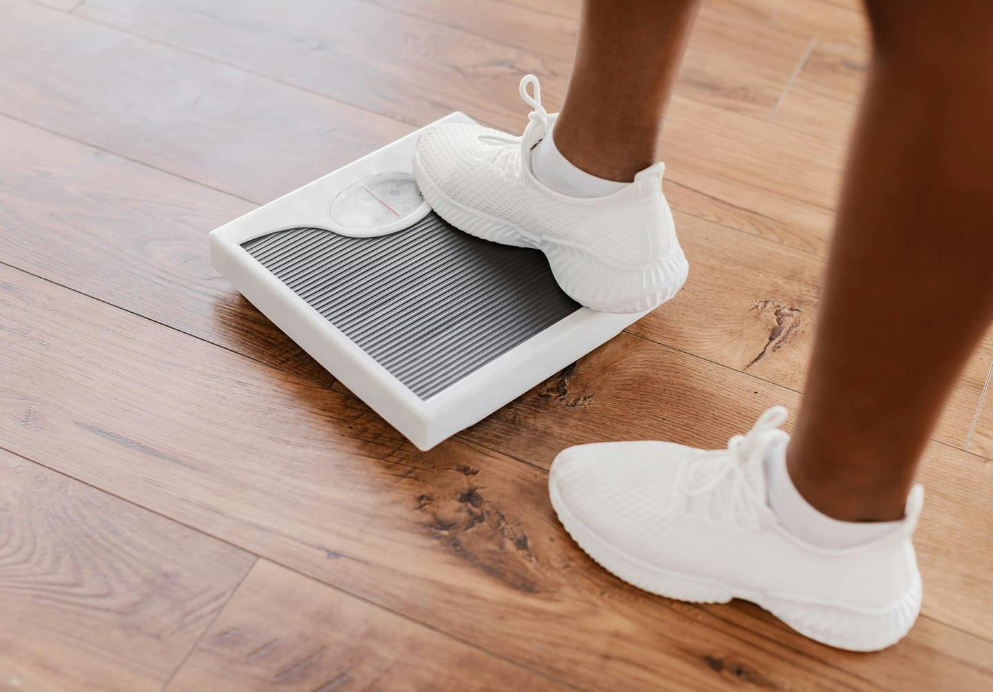 Person stepping onto scale