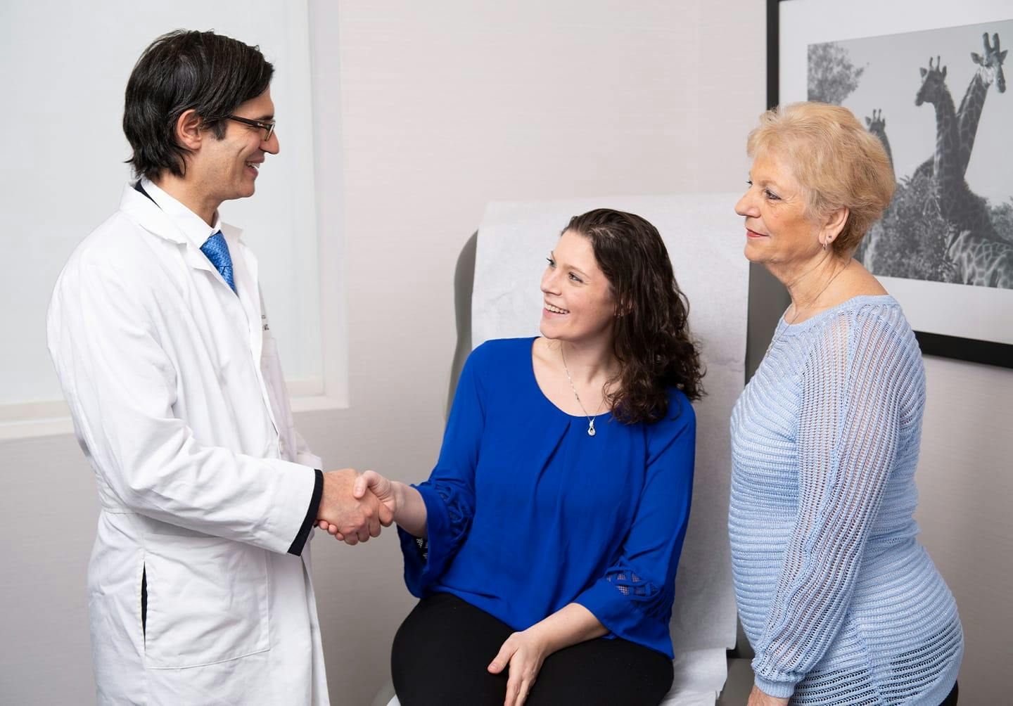 Woman shaking doctor's hand