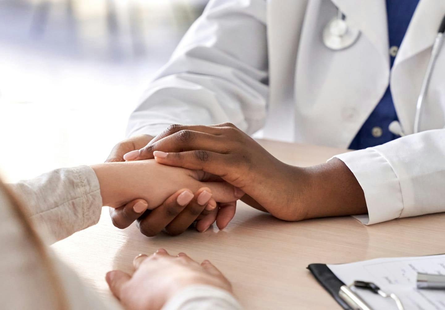 Doctor holding a person's hand