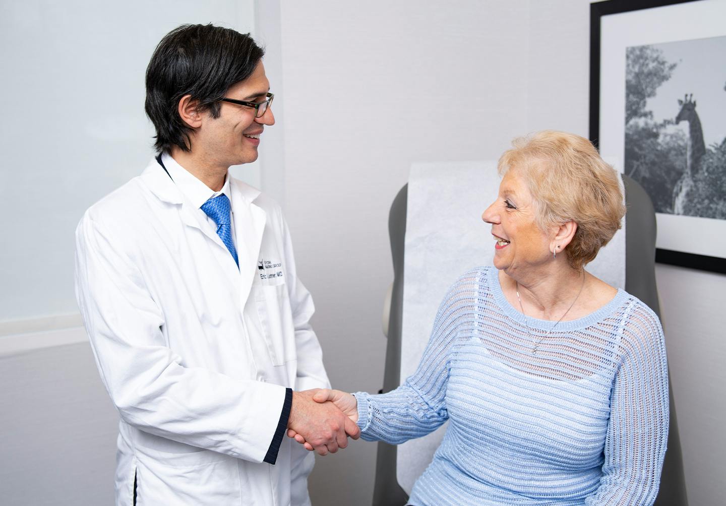 Doctor shaking woman's hand