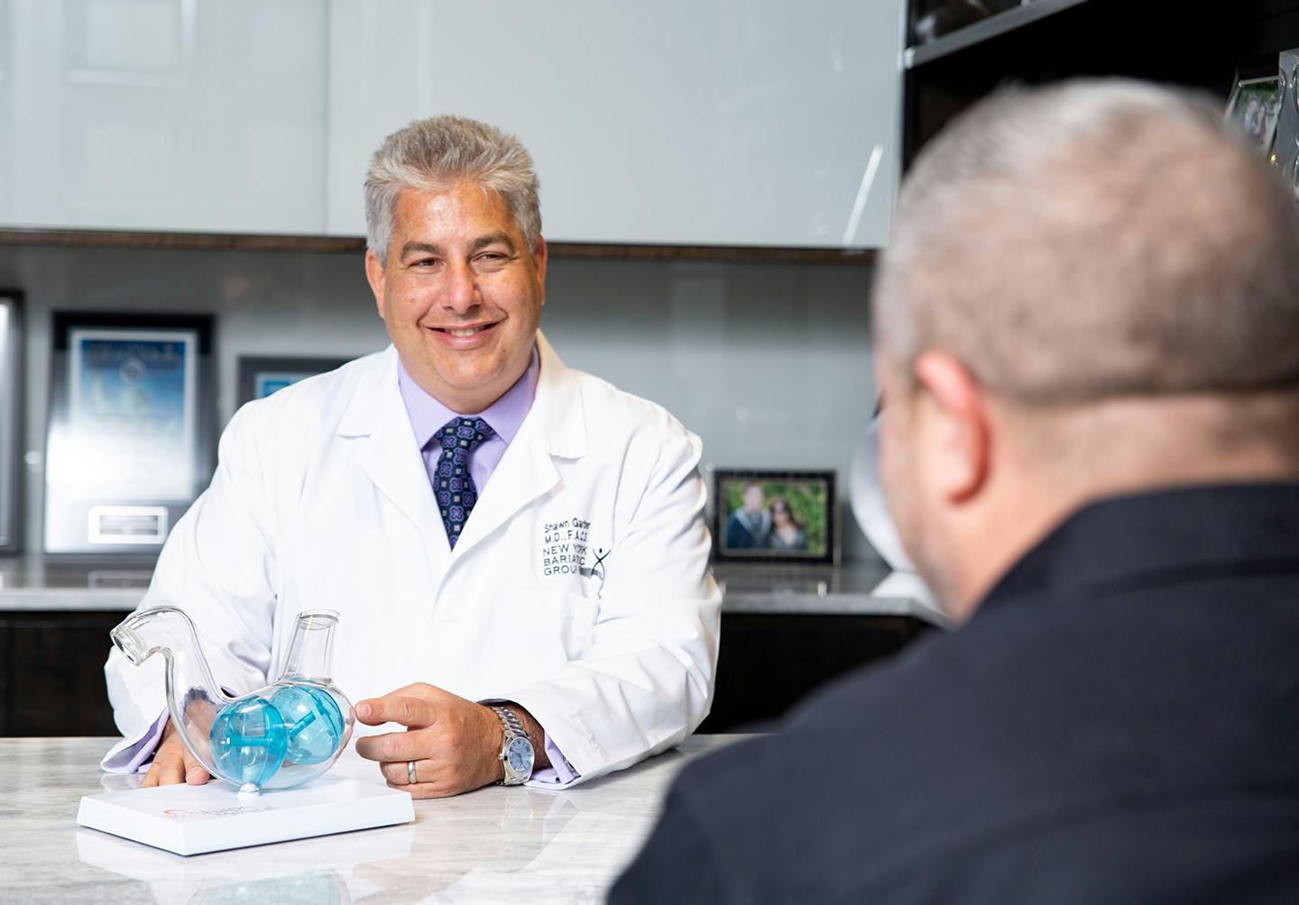 Doctor explaining procedure to man