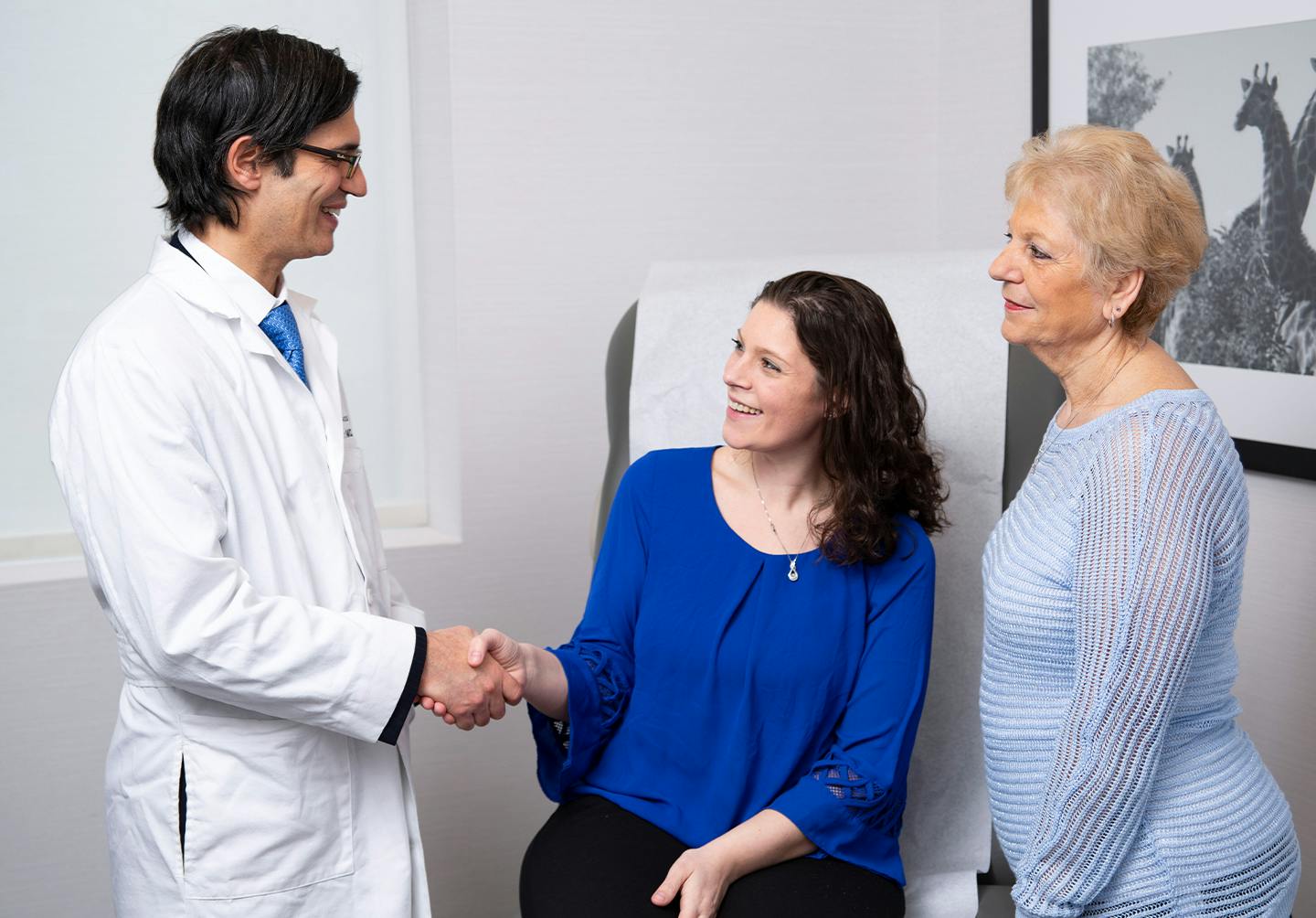 Woman shaking doctor's hand